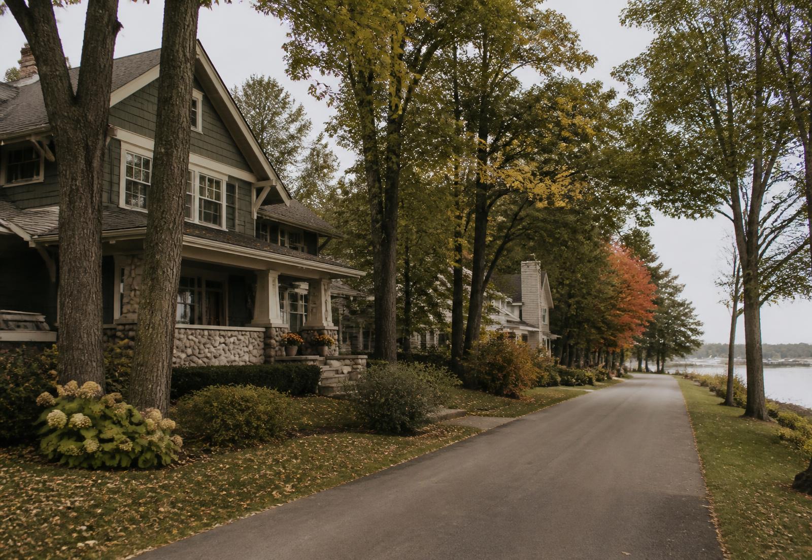 A tree-lined Minnesota lakeside street in early autumn